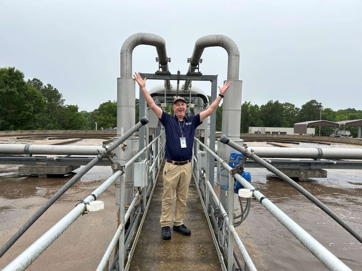 worker stands on clarifier path 