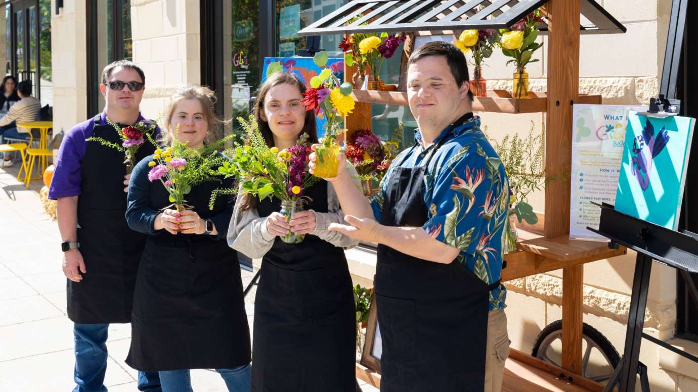 Gigis Playhouse People with flowers