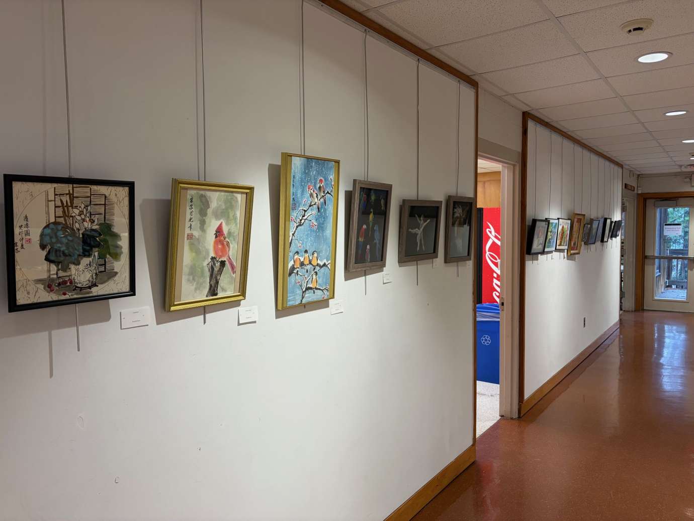 paintings in a variety of mediums on display 