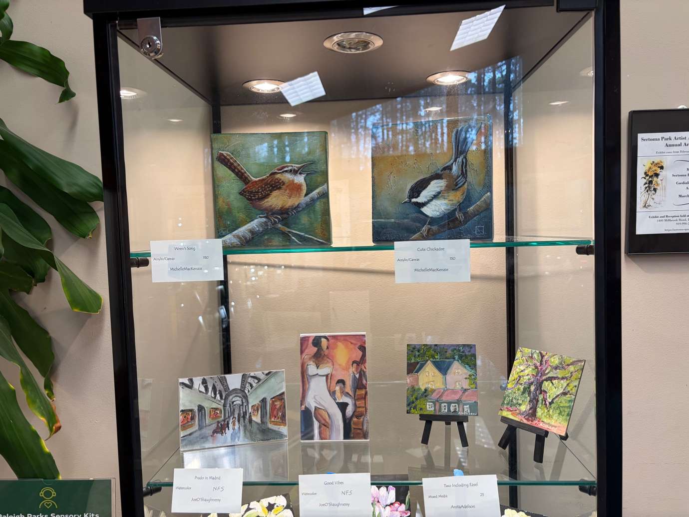 paintings in a variety of mediums on display 