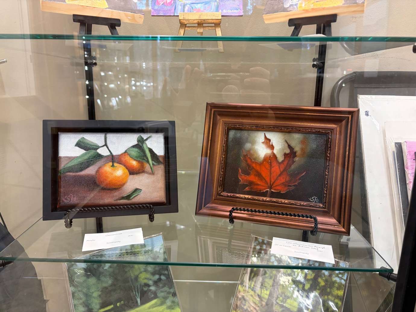 paintings in a variety of mediums on display 