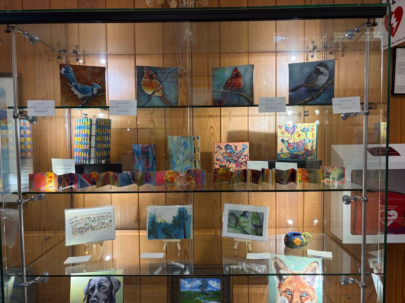 paintings in a variety of mediums on display 