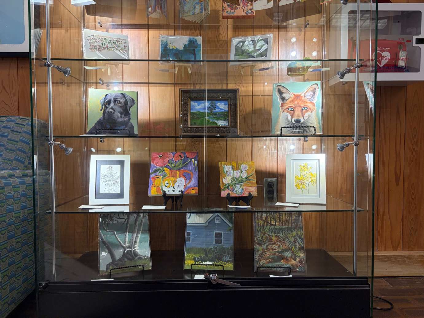 paintings in a variety of mediums on display 