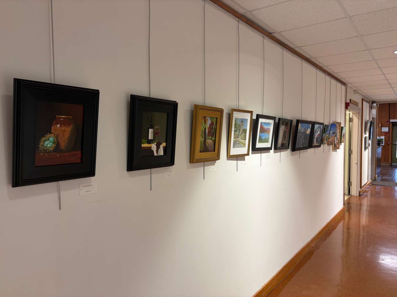 paintings in a variety of mediums on display 