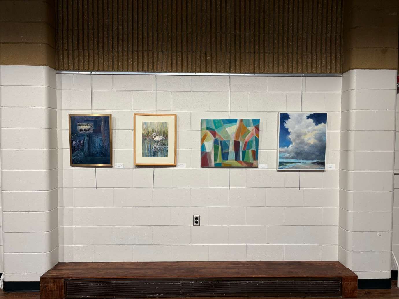 paintings in a variety of mediums on display 