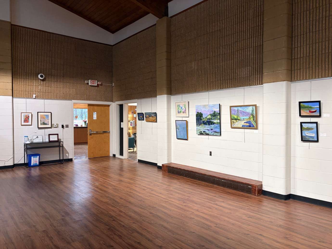 paintings in a variety of mediums on display 