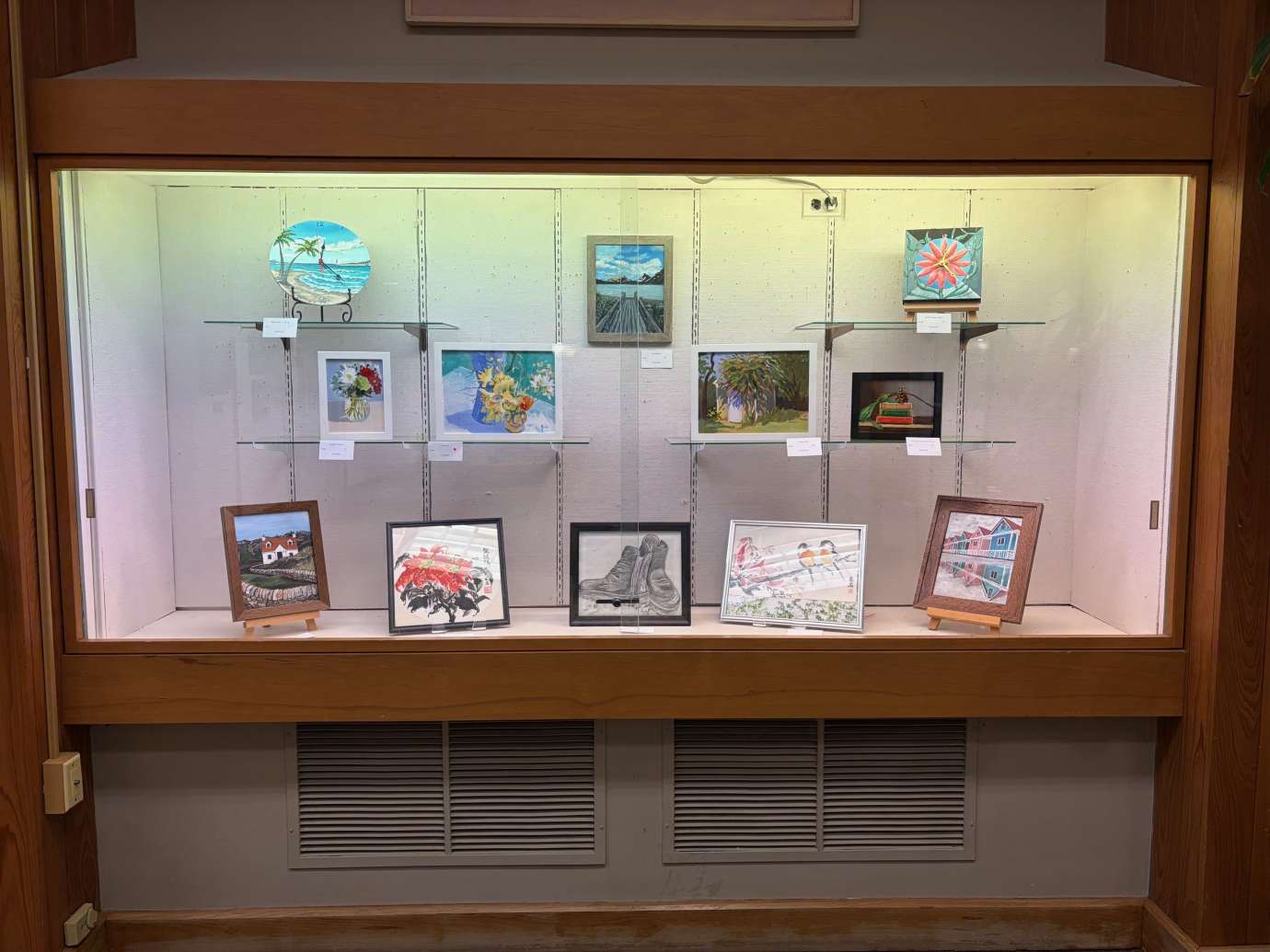 paintings in a variety of mediums on display 