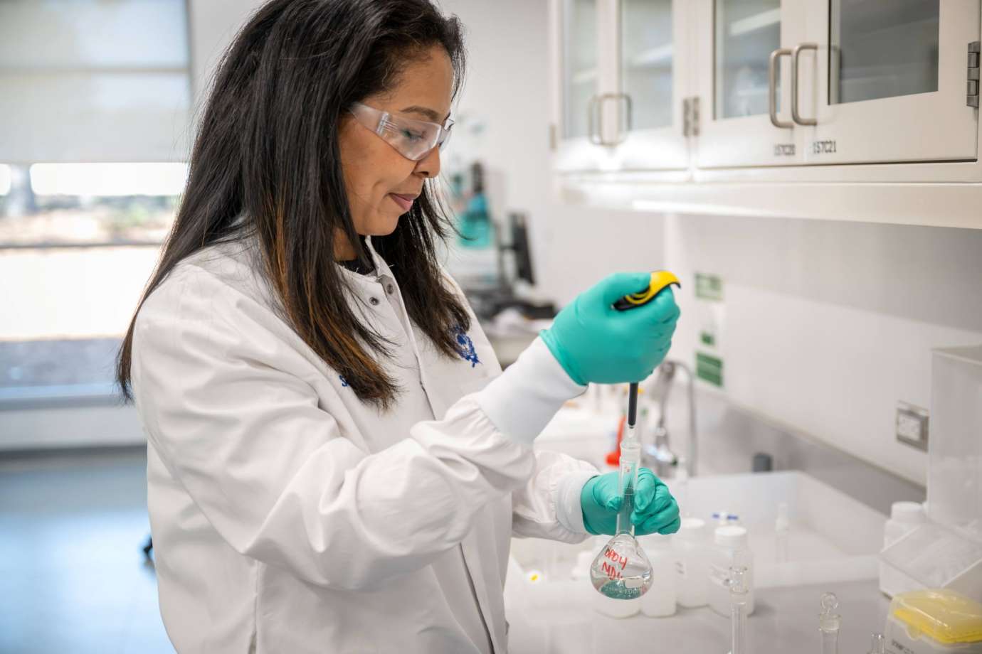 water worker testing samples in lab