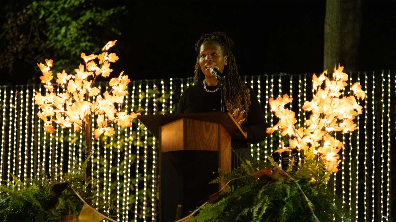 a person speaking at a podium