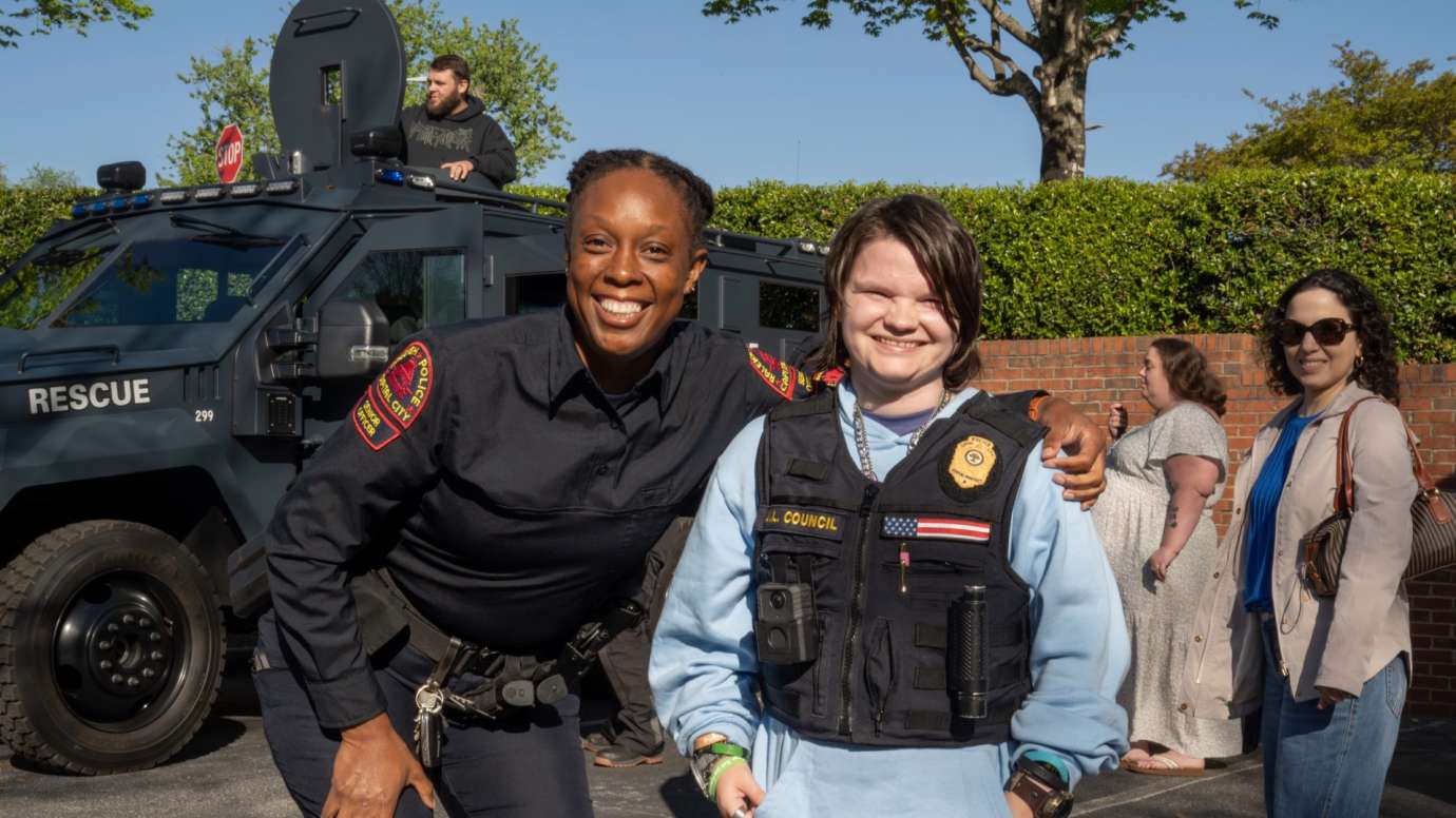 Police officer smiling with child