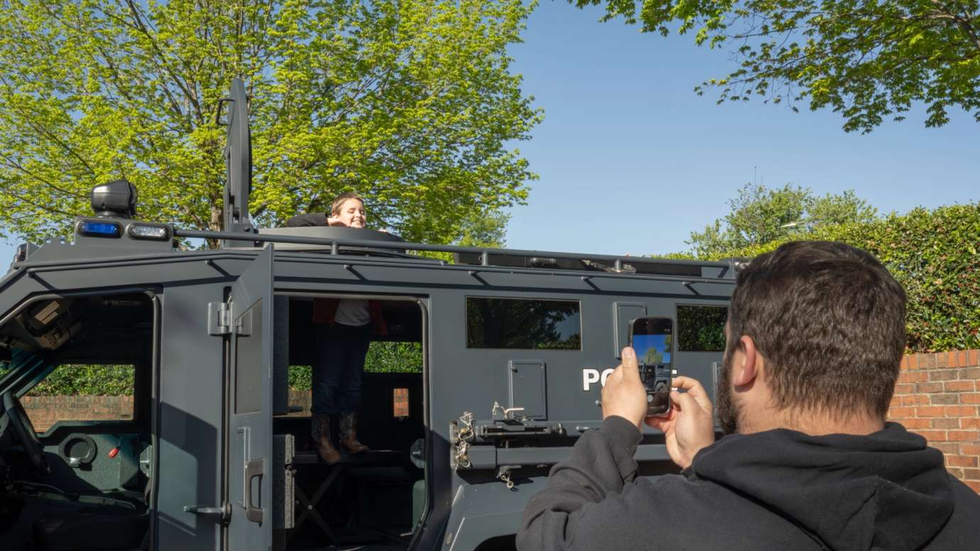 Parent takes photo of son on police truck