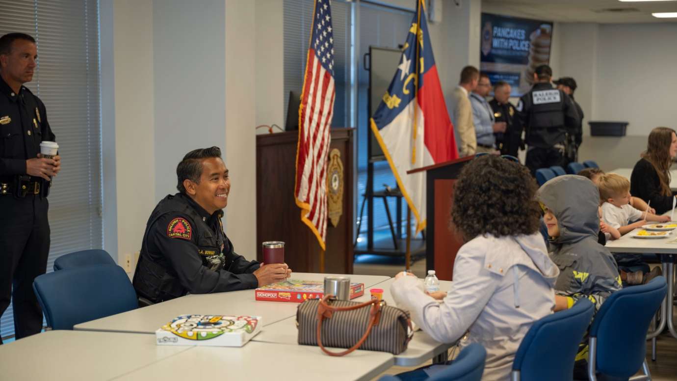 Police officer sitting at table