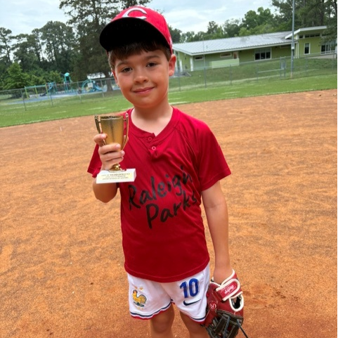 Griffin H. holding T-ball Sportsmanship Award