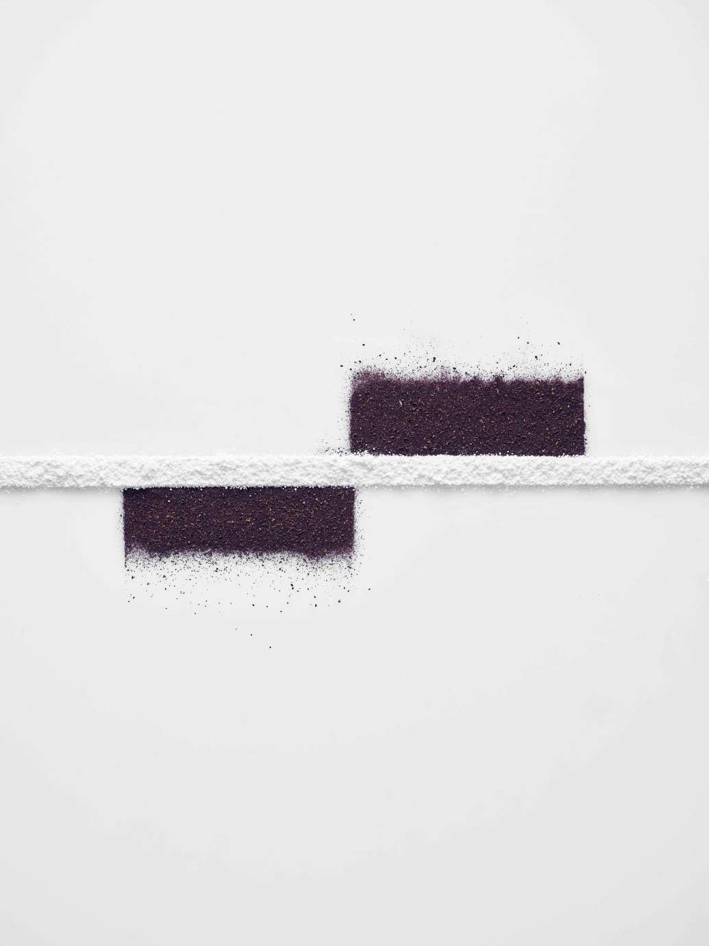 Dark powder above and below white line