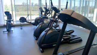 Treadmills and elliptical machines in the Abbotts Creek Fitness Room