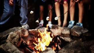 Roasting marshmellows around the campfire