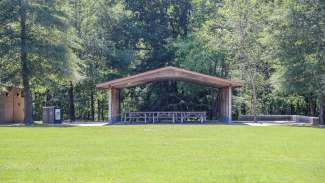 A second smaller picnic shelter with 12 tables near the restrooms