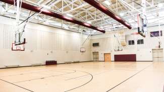 Barwell Road Park gymnasium featuring multiple basketball hoops and open floor 