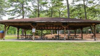 Outdoor picnic shelter with eight tables at Biltmore Hills Park 