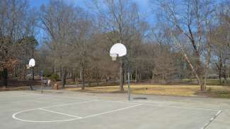 Boys playing at the outdoor basketball courts at Brentwood 