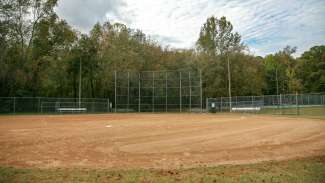 An open youth baseball field located near the tennis courts at Brentwood Park 
