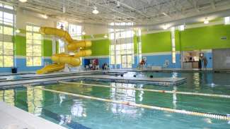 Shot of the slide, pool and lanes at the Buffaloe Road Aquatic Center 
