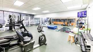 weight and cardio machines in fitness room at Millbrook Exchange Park