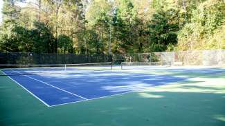 Outdoor tennis courts at Glen Eden Pilot Par. There are four courts total 