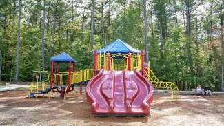 Honeycutt Park playground with multiple slides. For ages 5-12