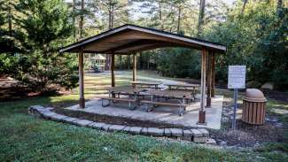 Picnic shelter with four tables and one grill at Kentwood Park
