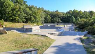 A large outdoor skate park which offers street, flow and bowl elements