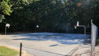 Two outdoor basketball courts at Sanderford Road Park 
