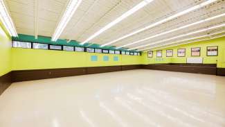 A large open meeting room with windows at Tarboro Road