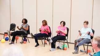 A group of ladies participating in a exercise class at Anne Gordon 