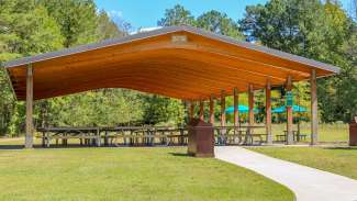 One of two picnic shelters with multiple seating and two grills 