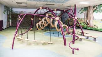 An indoor playground with climbing equipment and more