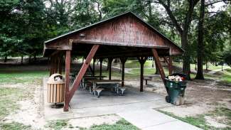 A second outdoor picnic shelter with six tables