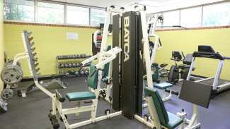 A variety of gym equipment and weights 