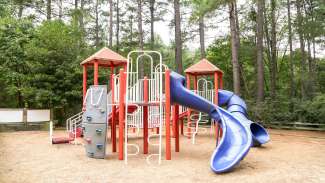A second large playground for older kids with a bigger slide and climbing equipment 