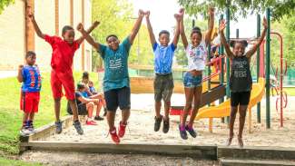 Kids jumping and enjoying a summer camp at Tarboro Road