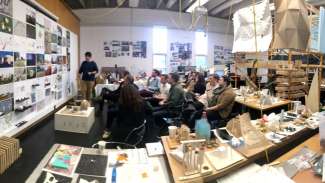 A studen gives a presentation in a design studio class at North Carolina State University