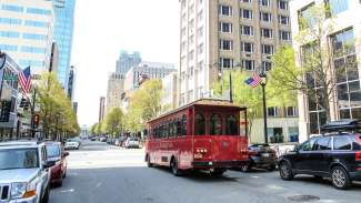 View of the historic Raleigh Trolley driving around downtown Raleigh