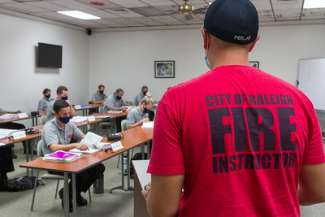 Fire department instructor teaching a class at academy