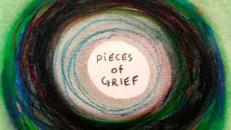 A drawing of multiple circles, with the words Pieces of Grief in the middle