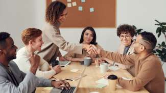 businesswoman shaking hands on a deal