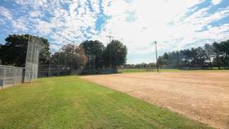 A large open field used for baseball and softball 