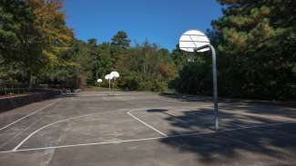 A shot of the two outdoor basketball courts, with four hoops total 