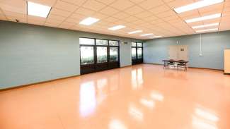 A large open room with room for classes, meetings or games