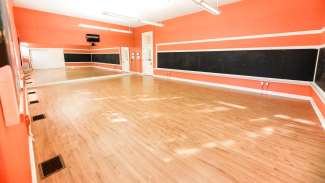 A large, open room used for dance and fitness classes