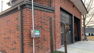 The rain gauge signal box installed on the outside of Fire Station 15. 